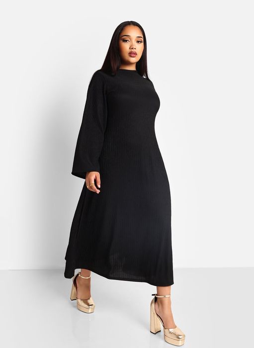 front view of a model wearing a black dress