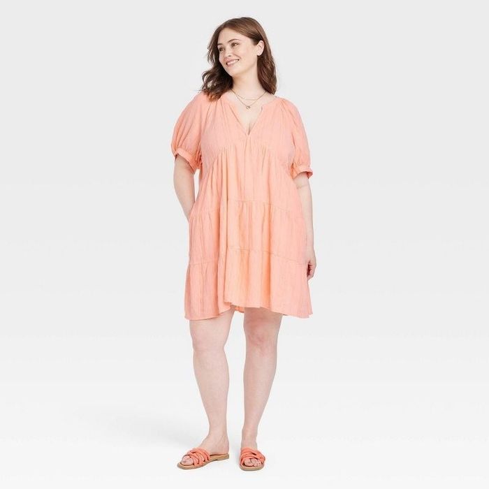 Model showcasing the pink dress