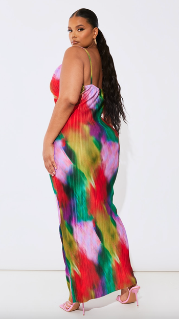 A back view of the same model showcasing the dress