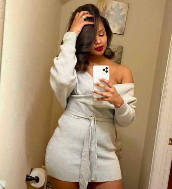 A customer review photo of them wearing the gray dress
