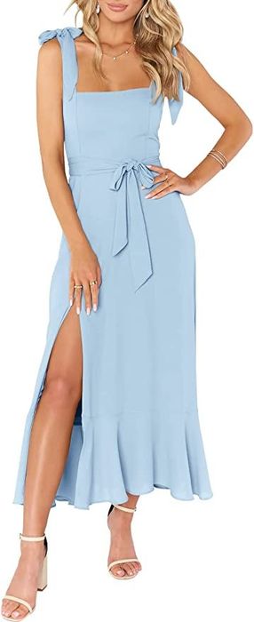 A front view of a model wearing the light blue dress with tie-waist detailing
