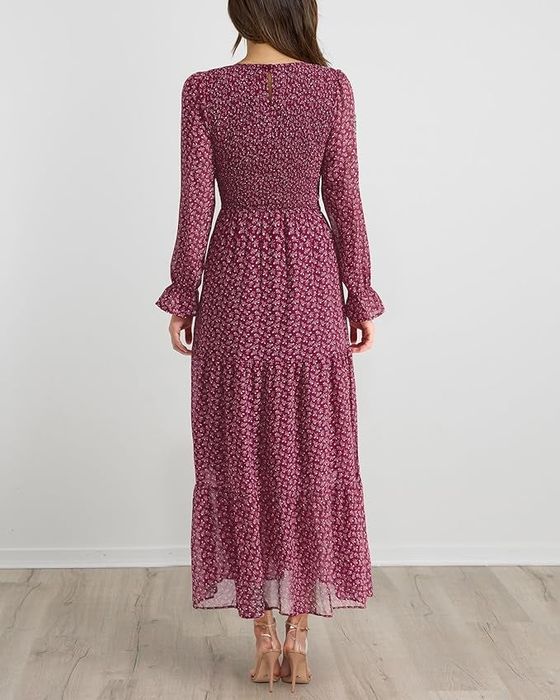 back view of a model in a red floral tiered midi dress