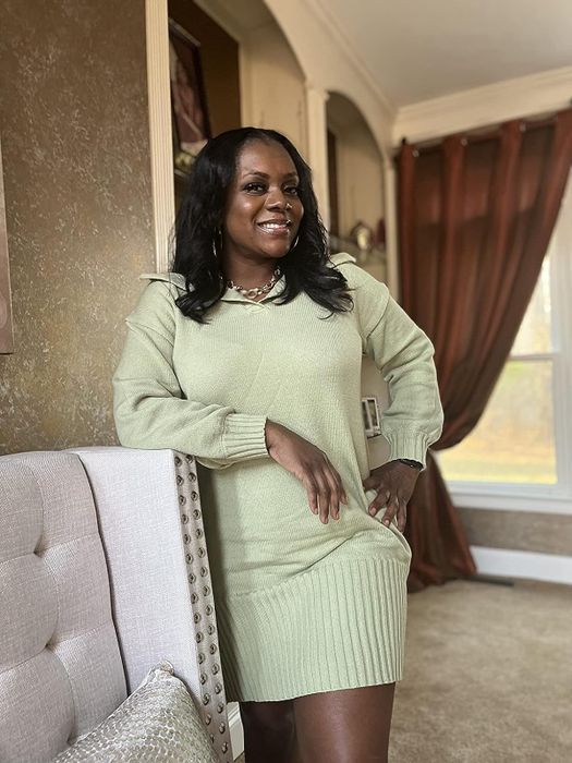 A reviewer modeling the mint green dress