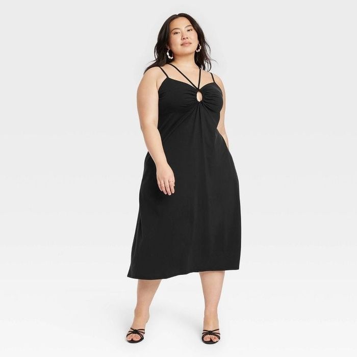 Model showcasing the black dress