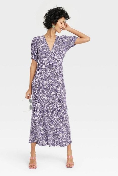 Reviewer showcasing the navy blue floral dress