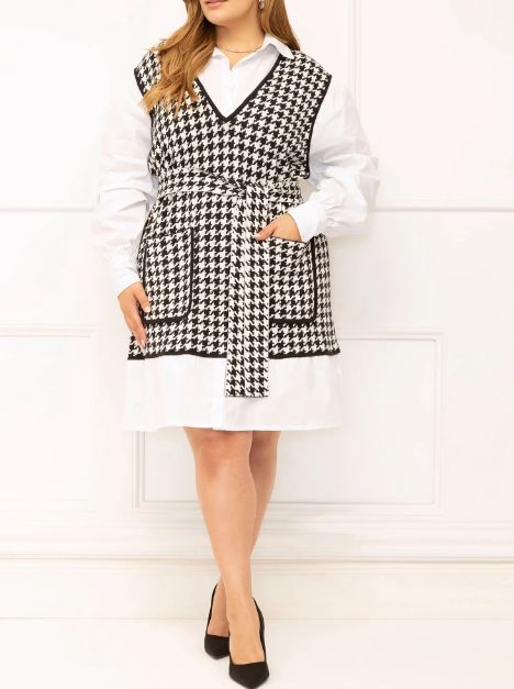 model showcasing a shirt dress with a layered sweater design