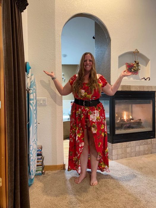 reviewer in a red floral dress