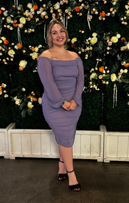 another reviewer in a purple puff-sleeve midi dress