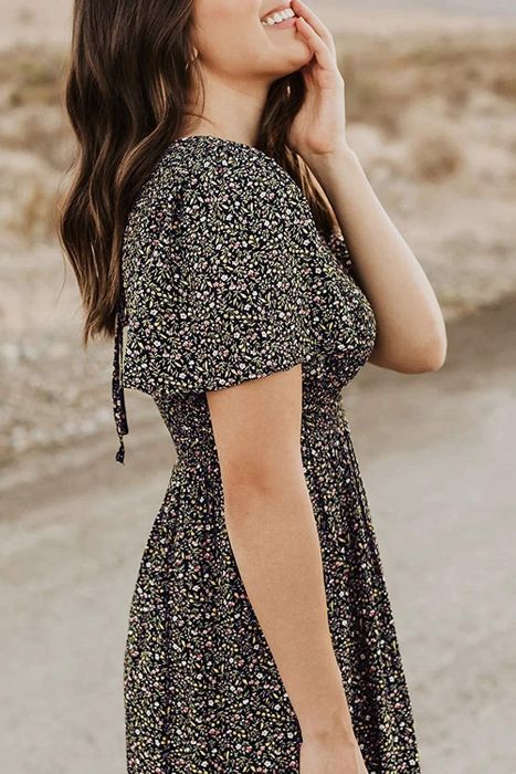 A detailed view of the dress sleeve on the model