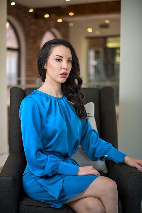 Reviewer modeling the solid blue dress