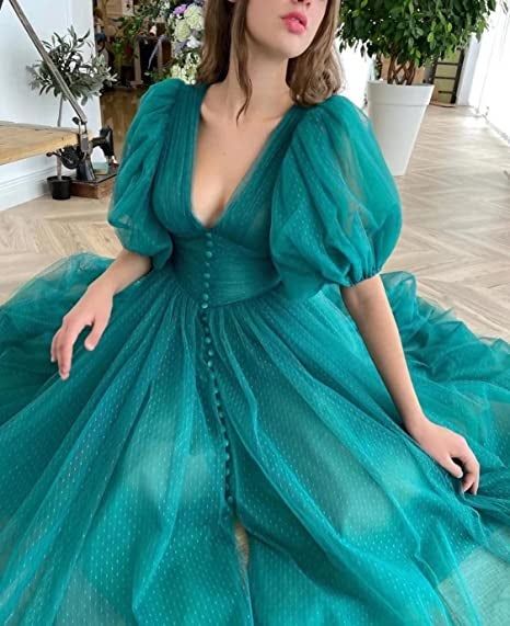 a model showcasing the teal dress