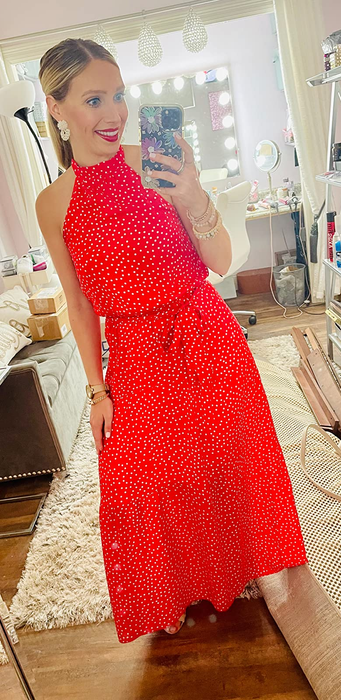 another reviewer showcasing the dress in red and white polka dots