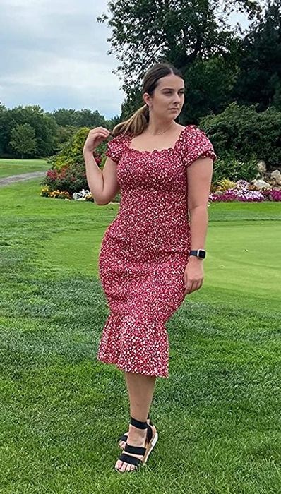 Reviewer modeling the red dress