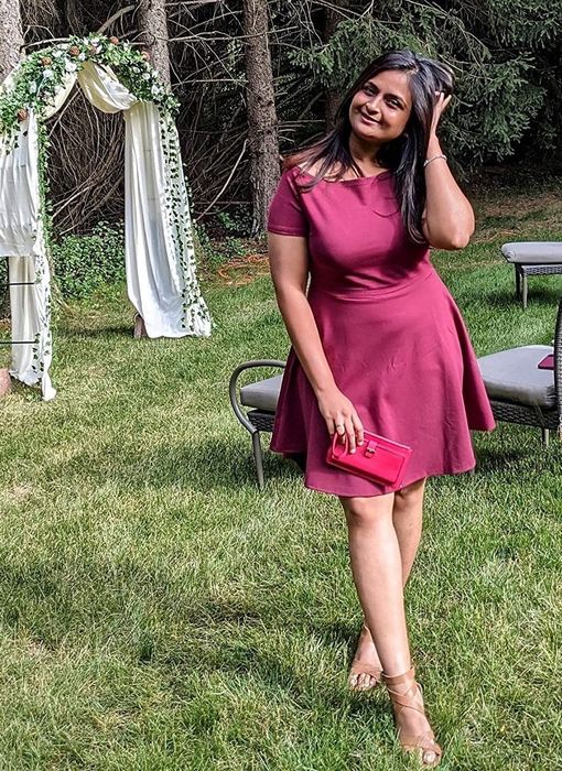 Reviewer wearing the burgundy dress