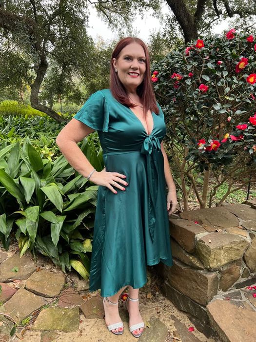 another reviewer modeling the dress in a fresh green shade