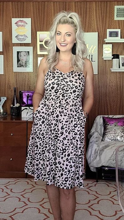 A person wearing the leopard print dress