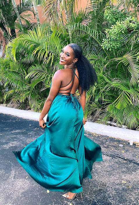 Another reviewer showcasing the back view of the dress in a vibrant green hue