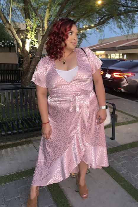 Another reviewer sporting the dress in a soft pink shade with a white tank top layered underneath for a fresh take