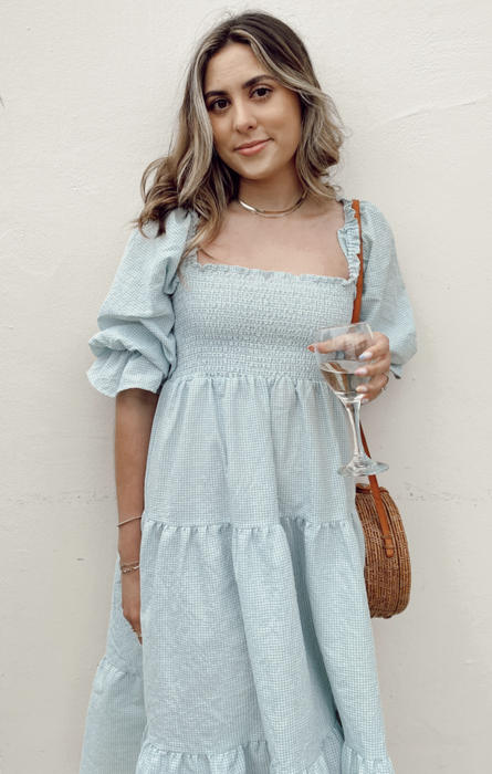 A photo from a customer review showcasing them wearing the dress