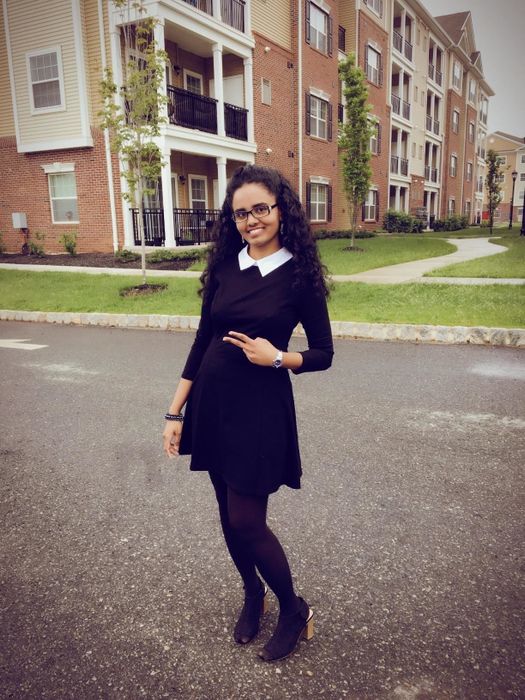 Another reviewer wearing the same dress, showcasing its mid-thigh length in a full-body view