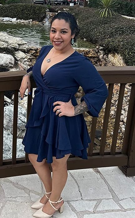 Reviewer wearing the navy blue dress