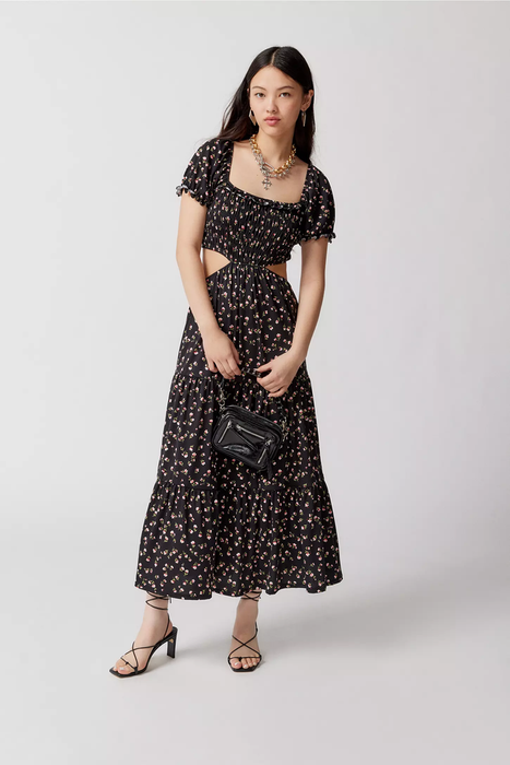 A model showcasing the black floral dress