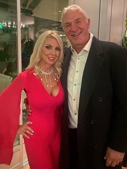 an Amazon reviewer wearing the jumpsuit in red