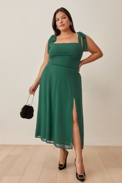 A model wearing a stunning green maxi dress