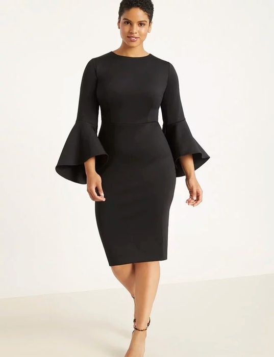 A model showcasing the full look of the sleek black bodycon dress.