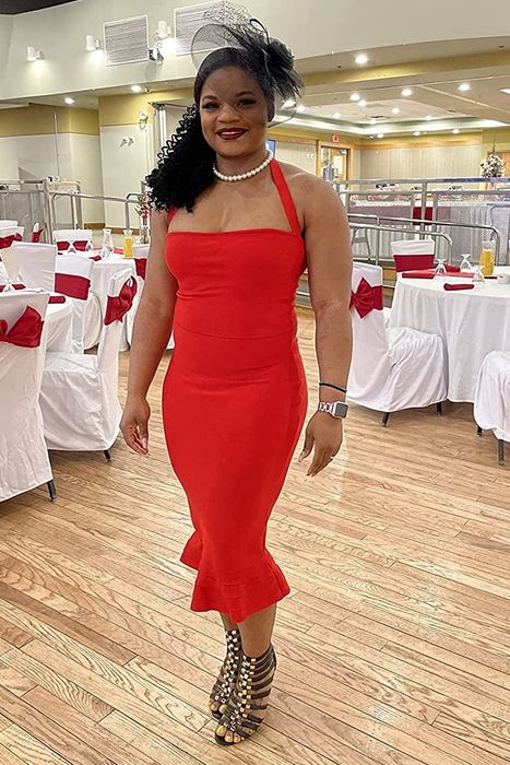 Reviewer modeling the red dress