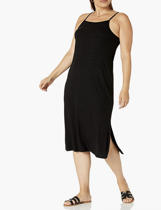 A model showcasing a sleeveless black square-neck strappy dress.