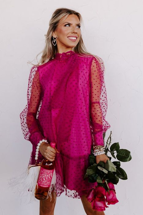 A close-up view of the stunning pink dress, highlighting its fine details.