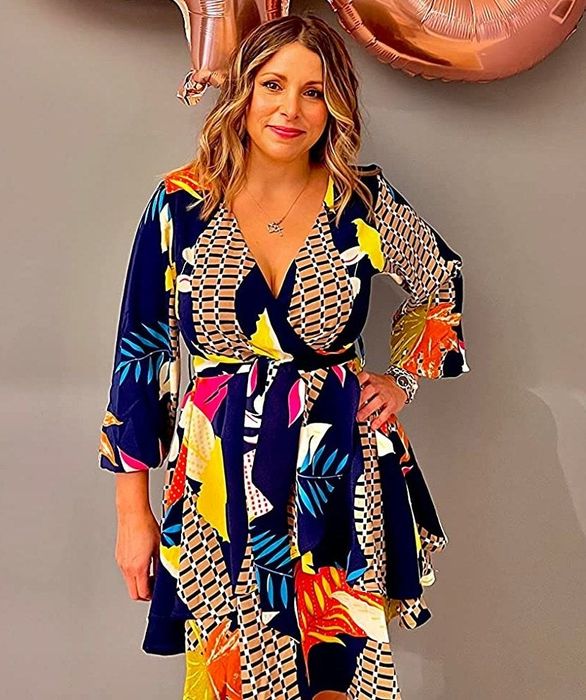 Reviewer modeling the geometric leaf print dress