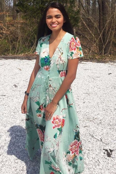 Reviewer wearing the green dress
