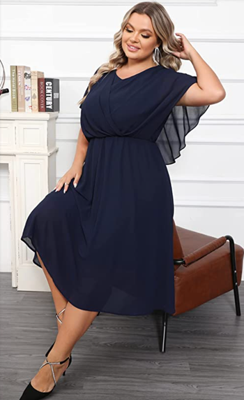 a model wearing the blue version of the dress