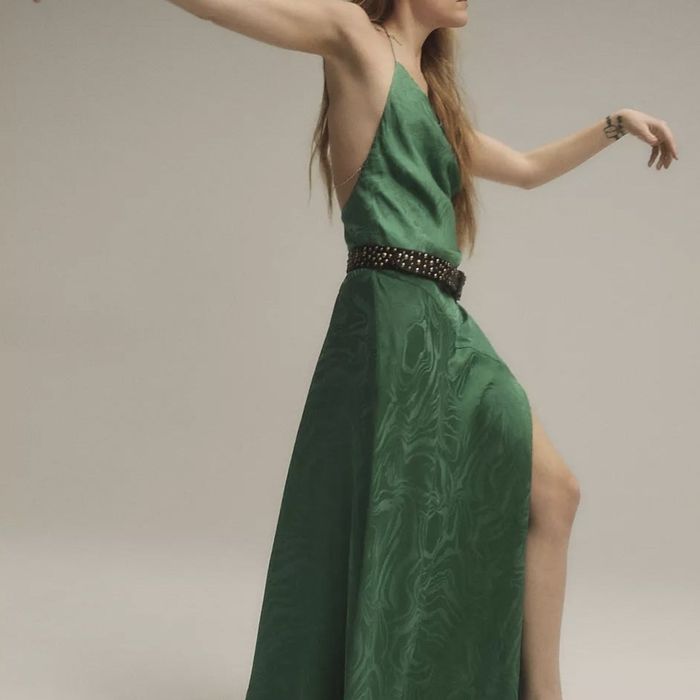 Riley Keough modeling a green dress for the Free People x Daisy Jones & The Six campaign