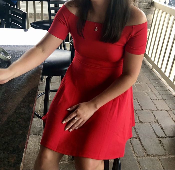 Reviewer modeling the off-the-shoulder dress