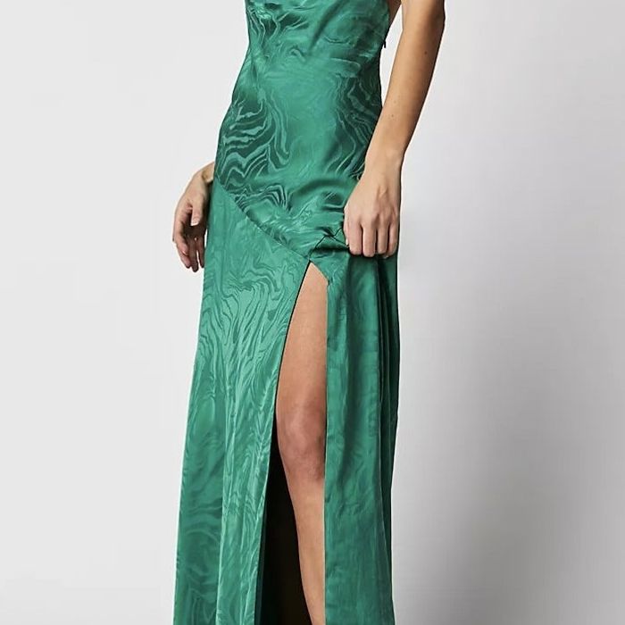 A model showcasing the green dress