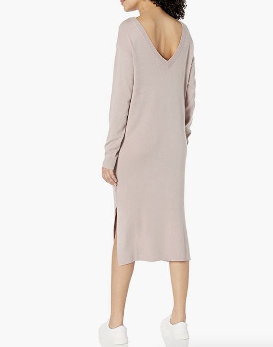 Model wearing the same sweater dress in a soft pink color