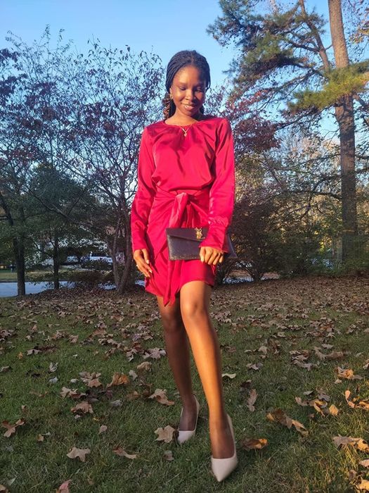 Reviewer wearing the wine-colored dress
