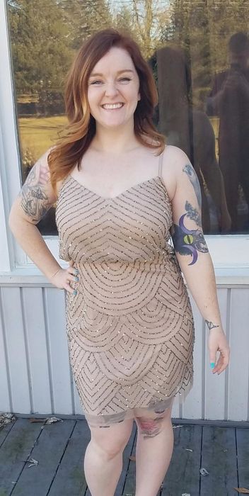Reviewer wearing the taupe pink dress