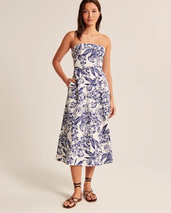 A model showcasing a blue and white dress.