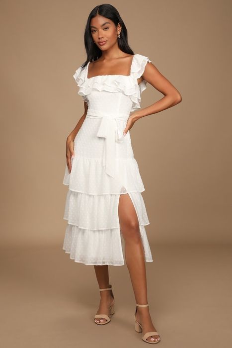 model wearing a chic white ruffle midi dress