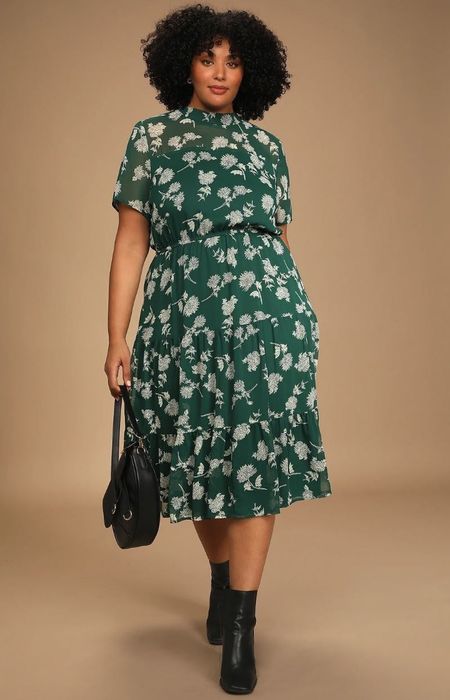 model wearing a stylish green floral midi dress