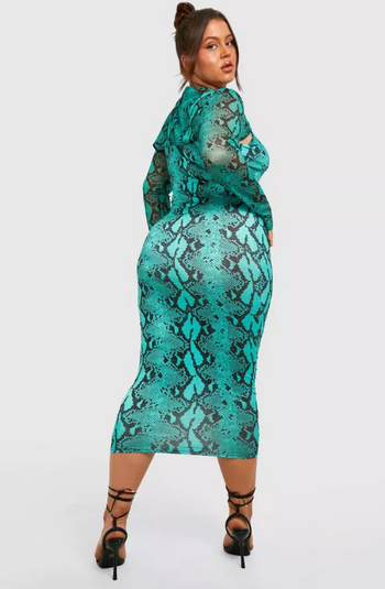 Same model highlighting the back view of the dress