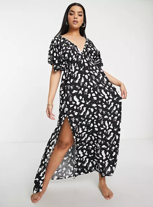 model wearing the black and white dress