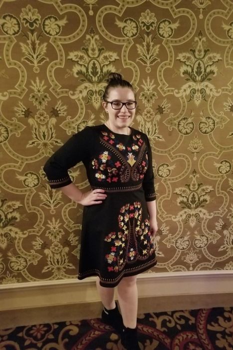 A reviewer styling the dress with trendy booties