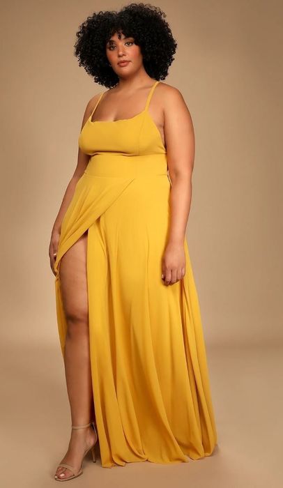 model wearing a vibrant yellow maxi dress