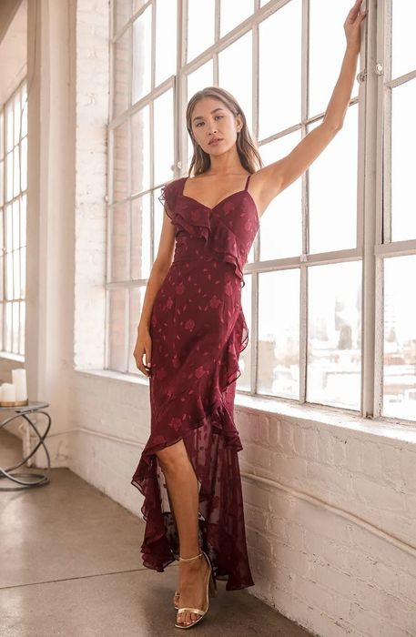 model wearing an elegant burgundy maxi dress