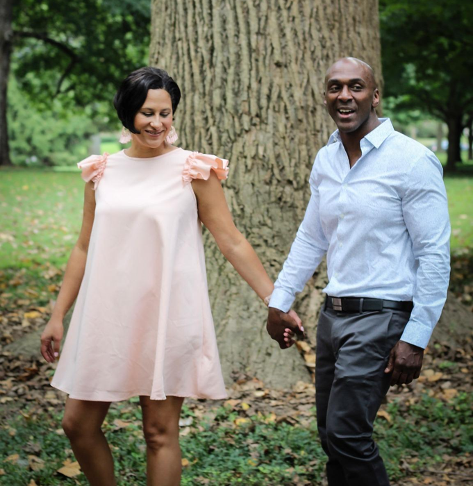 reviewer wearing the light pink dress